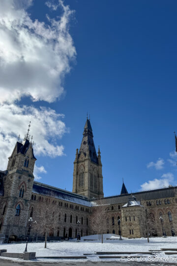 Parliament buildings in Ottawa in March with a bright blue sky behind.